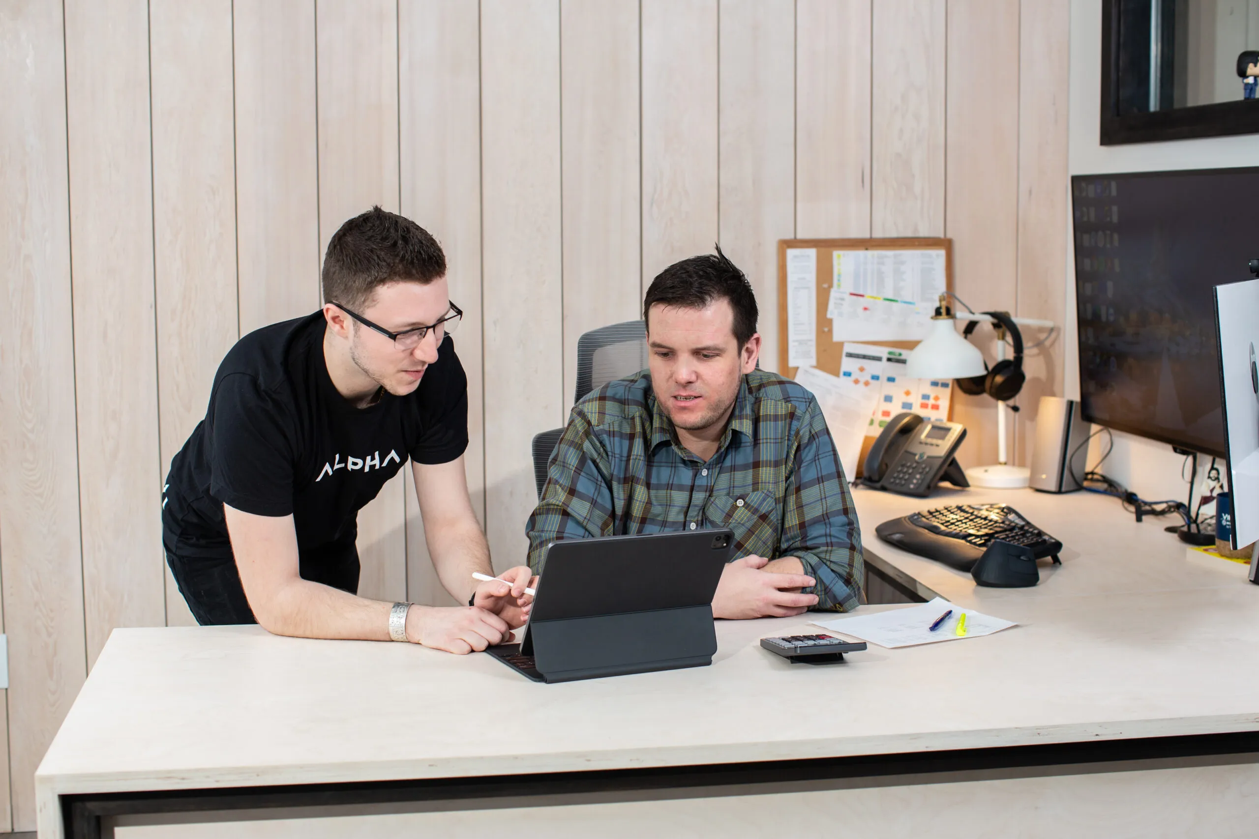 Alpha techs sitting at desk working