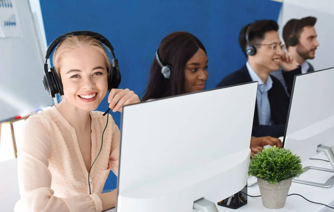 Multiple customer service agents with headphones